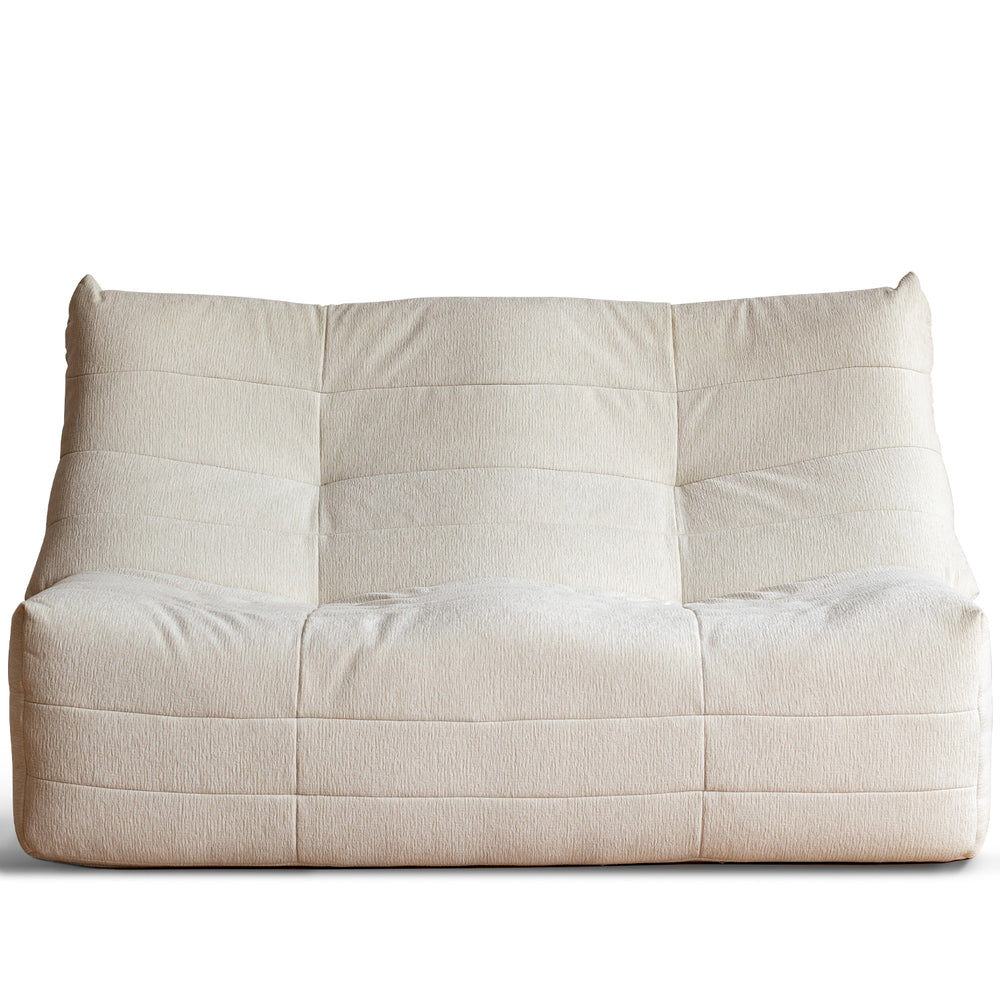 Cream chenille velvet fabric 2 seater sofa curly in white background.