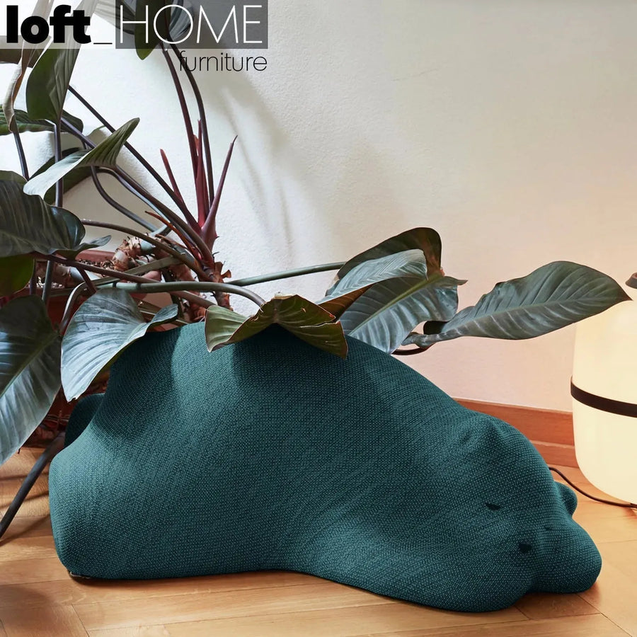 Contemporary knit fabric ottoman resting bear primary product view.