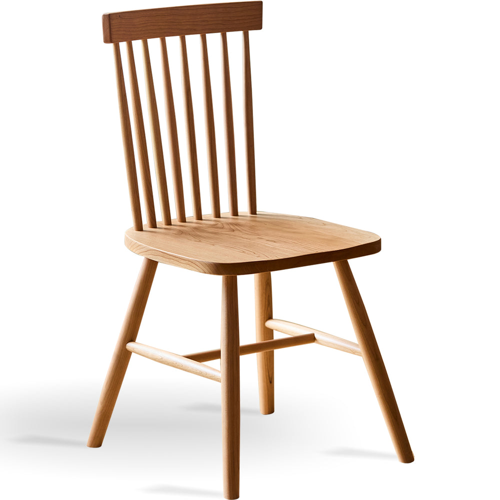Scandinavian cherry wood dining chair windsor in white background.